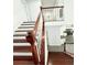 Elegant staircase featuring white railings and wooden stairs at 8304 Parasol Ct., Myrtle Beach, SC 29579