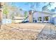 Wide backyard view features outdoor lounge area, fire pit, and shed at 908 Cedarwood Circle, Myrtle Beach, SC 29572