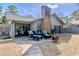 Backyard patio with outdoor seating and brick fireplace at 908 Cedarwood Circle, Myrtle Beach, SC 29572