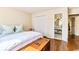 Bedroom featuring hardwood floors, double closets, an en suite bathroom, and chest at 908 Cedarwood Circle, Myrtle Beach, SC 29572