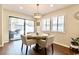 Bright dining area with hardwood floors and sliding door to patio at 908 Cedarwood Circle, Myrtle Beach, SC 29572