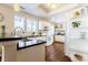 Modern kitchen with white cabinets, black countertops, and stainless steel sink at 908 Cedarwood Circle, Myrtle Beach, SC 29572