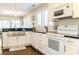 Bright kitchen with stainless steel appliances, white cabinetry, and lots of natural light at 908 Cedarwood Circle, Myrtle Beach, SC 29572