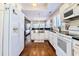 Well-lit kitchen features stainless steel appliances and lots of natural light at 908 Cedarwood Circle, Myrtle Beach, SC 29572