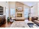 Inviting living room with a brick fireplace and large windows for natural light at 908 Cedarwood Circle, Myrtle Beach, SC 29572