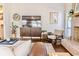 Bright living room featuring a large TV, stylish furniture, and a brick fireplace at 908 Cedarwood Circle, Myrtle Beach, SC 29572