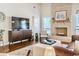 Spacious living room featuring a brick fireplace and stylish furniture at 908 Cedarwood Circle, Myrtle Beach, SC 29572