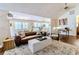 Cozy living room features a leather sofa, area rug, and open floor plan at 908 Cedarwood Circle, Myrtle Beach, SC 29572