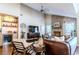 Spacious living room featuring a brick fireplace, modern lighting, and stylish decor at 908 Cedarwood Circle, Myrtle Beach, SC 29572