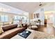 Bright living room with hardwood floors, vaulted ceiling, and an open layout to the kitchen at 908 Cedarwood Circle, Myrtle Beach, SC 29572