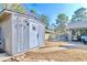 Exterior shed with a decorative front; backyard with outdoor seating area in view at 908 Cedarwood Circle, Myrtle Beach, SC 29572