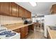 Functional kitchen featuring wood cabinets, a dining table, wood floors, and open access to the living space at 913 S Dogwood Dr. S, Surfside Beach, SC 29575