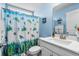 Bright bathroom featuring a charming turtle-themed shower curtain and complementary turtle decor accents at 931 Desert Wheatgrass Dr., Myrtle Beach, SC 29579