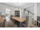 This dining room features a modern chandelier, neutral colors and wood floors at 931 Desert Wheatgrass Dr., Myrtle Beach, SC 29579