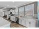 Kitchen featuring white cabinets, stainless steel appliances, and a decorative backsplash at 931 Desert Wheatgrass Dr., Myrtle Beach, SC 29579