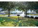 Serene park view of a community lake with a fountain, picnic area, and lush green space at 931 Desert Wheatgrass Dr., Myrtle Beach, SC 29579