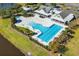 Aerial view of a community pool featuring well-manicured landscaping and a splash pad with lounge chairs at 931 Desert Wheatgrass Dr., Myrtle Beach, SC 29579