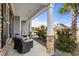 Cozy front porch with seating area featuring stylish outdoor furniture and decorative stone accents at 931 Desert Wheatgrass Dr., Myrtle Beach, SC 29579