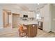 Bright kitchen featuring white cabinetry, breakfast bar, stainless appliances, and modern countertops at 9450 Old Palmetto Rd., Murrells Inlet, SC 29576