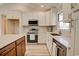 Modern kitchen with quartz countertops, stainless steel appliances, and updated white cabinetry at 9450 Old Palmetto Rd., Murrells Inlet, SC 29576