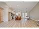 Bright open-concept kitchen featuring stainless appliances, white cabinets, breakfast bar, and French doors at 9450 Old Palmetto Rd., Murrells Inlet, SC 29576