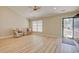 Bright living room with vaulted ceilings, wood-look floors, and comfortable seating area at 9450 Old Palmetto Rd., Murrells Inlet, SC 29576