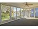 Bright sunroom with water views and floor-to-ceiling windows at 9450 Old Palmetto Rd., Murrells Inlet, SC 29576