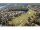 Picturesque aerial view of a community with golf course, water features, and lush green landscaping at 9684 Ravello Ct., Myrtle Beach, SC 29577