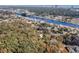 Aerial view of a wooded lot marked for development near a waterway, offering privacy and natural beauty at 9684 Ravello Ct., Myrtle Beach, SC 29577