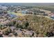 Aerial view of a wooded lot near a golf course, with mature trees and luxury homes nearby at 9684 Ravello Ct., Myrtle Beach, SC 29577