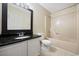 Bathroom with sleek granite countertop, single sink vanity, shower and modern fixtures at 1130 Ganton Way, Myrtle Beach, SC 29588