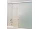Bathroom shower and tub with a sliding glass door and a white towel at 1207 S Ocean Blvd. # 51305, Myrtle Beach, SC 29577