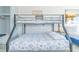 Bedroom features a bunk bed and cozy queen bed with stylish bedding at 1207 S Ocean Blvd. # 51305, Myrtle Beach, SC 29577