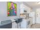 Bright kitchen features white appliances and breakfast bar seating at 1207 S Ocean Blvd. # 51305, Myrtle Beach, SC 29577