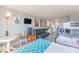 Inviting living area featuring a sofa, table, kitchenette, and bunk beds, creating a comfortable and functional space at 1207 S Ocean Blvd. # 51305, Myrtle Beach, SC 29577