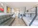 Well-lit living area includes a sofa, dining space, kitchenette, and bunk beds, maximizing the space's functionality at 1207 S Ocean Blvd. # 51305, Myrtle Beach, SC 29577