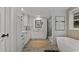 Elegant bathroom with a freestanding tub, modern vanity, and sleek black finishes at 123 Forman Way, Aynor, SC 29511