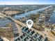 Aerial view of a waterfront community with boat docks and easy access to the Intracoastal Waterway at 129 Marblehead Dr., Little River, SC 29566