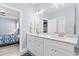 Bright bathroom with marble countertops, double sinks, and modern lighting fixtures at 129 Marblehead Dr., Little River, SC 29566