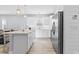 Bright kitchen with stainless steel appliances, island with marble countertops and a casual seating area at 129 Marblehead Dr., Little River, SC 29566