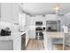 Contemporary kitchen featuring white cabinets, stainless steel appliances, and a marble countertop at 129 Marblehead Dr., Little River, SC 29566