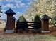 Community entrance sign for Chestnut Farms, surrounded by greenery and a decorative fence at 148 Joyce Dr, Longs, SC 29568