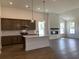 Spacious open kitchen featuring stainless steel appliances, wooden cabinets, and a central island at 148 Joyce Dr, Longs, SC 29568