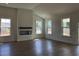 Bright living room with fireplace, and lots of natural light from large windows at 148 Joyce Dr, Longs, SC 29568