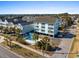 Charming three story beach condo with shared pool, balconies, and ample parking spaces at 1510 S Ocean Blvd. # 101, Surfside Beach, SC 29575