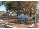 View of Fuller Park playground and amenities in a fenced area with shade trees at 1510 S Ocean Blvd. # 101, Surfside Beach, SC 29575