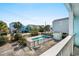 Enjoy a refreshing view of the neighborhood pool from the upper level balcony at 1510 S Ocean Blvd. # 101, Surfside Beach, SC 29575