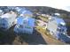 Aerial view of a neighborhood with homes featuring metal roofs and coastal architecture at 172 Enclave Pl., Pawleys Island, SC 29585