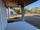 Covered porch with wood ceiling and serene backyard at 172 Enclave Pl., Pawleys Island, SC 29585