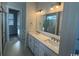 Bright bathroom featuring double sinks, a large mirror, and a glass-enclosed shower at 172 Enclave Pl., Pawleys Island, SC 29585